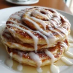 Cinnamon Roll Pancakes – Fluffy, Sweet & Drizzled with Creamy Icing!